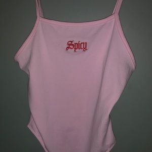 Pink bodysuit with red “spicy” lettering